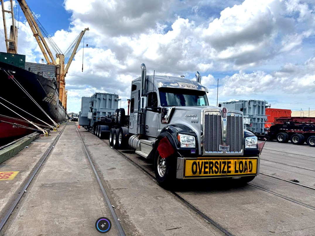 Tarped oversized load at sunrise